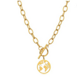Close up of gold chain necklace and world map pendant charm.
